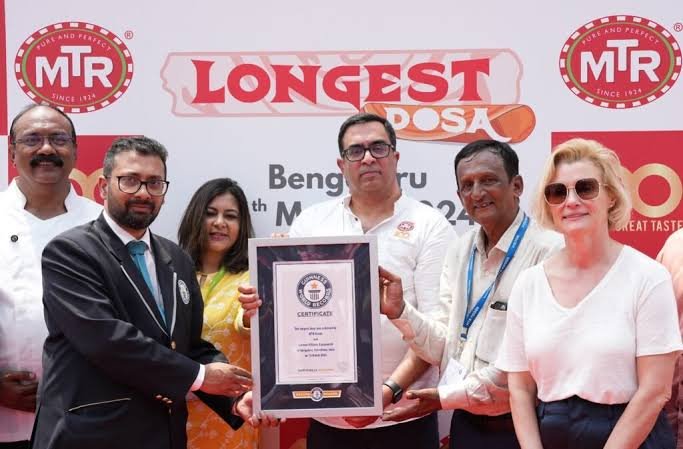 MTR Broke the Previous World Record title of longest Dosa of 16.68m (54 ft 8.69 
